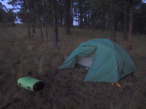 GDMBR: Our tent gear is packed into that large green waterproof bag.